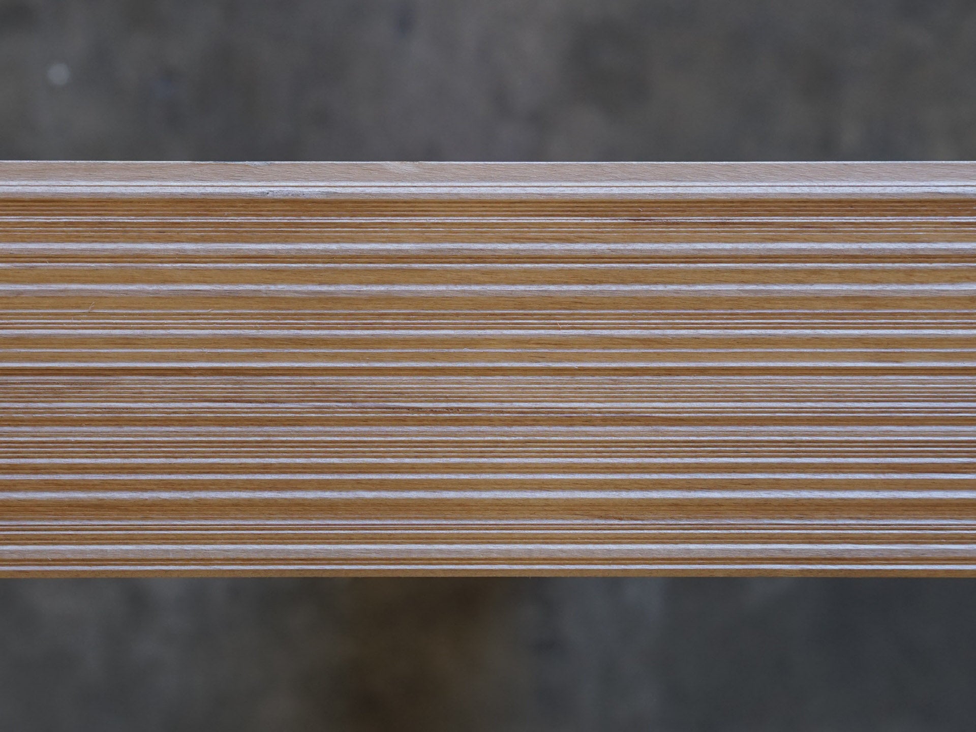 Top down photo of Weldtex tongue & groove alder hardwood plank consisting of a combed, striated, brushed wood appearance common in mid-century modern homes and design