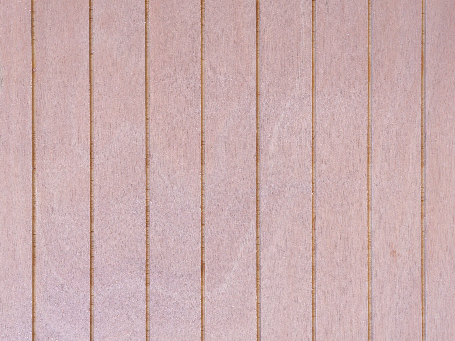 Close up of Thinline patterned plywood consisting of a 1/8” grooves, 1⅝” on center, commonly used as siding and paneling on Eichler homes and other mid-century modern design