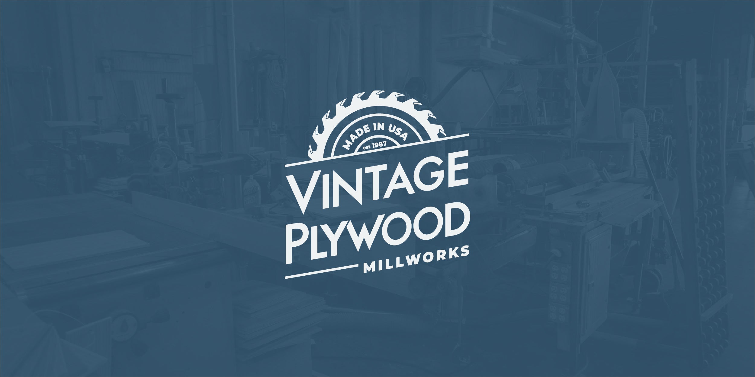 Homepage banner with Vintage Plywood Millworks' logo in the foreground and the shop in the background