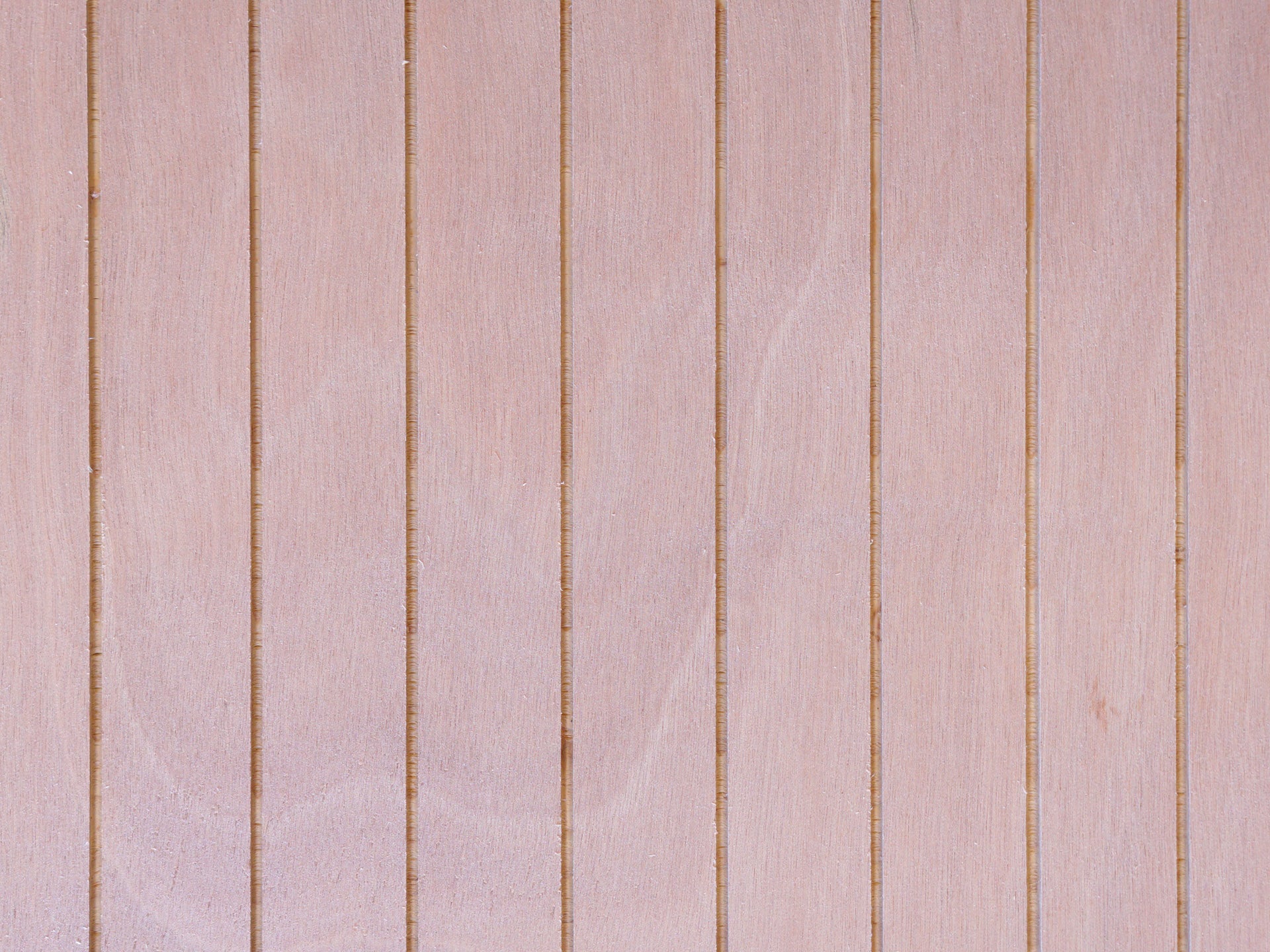 Close up of Vintage Plywood Millworks' Thinline siding showing the thin grooves and the wood grain