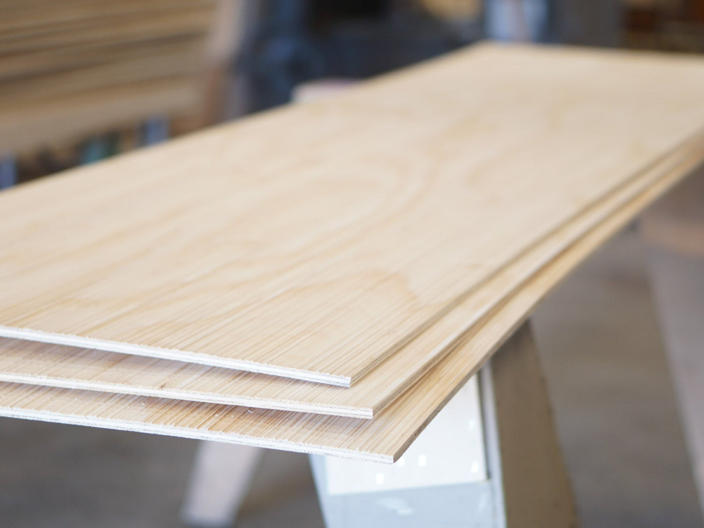 Stack of three Weldtex plywood panels consisting of a combed, striated, brushed wood appearance common in mid-century modern homes and design