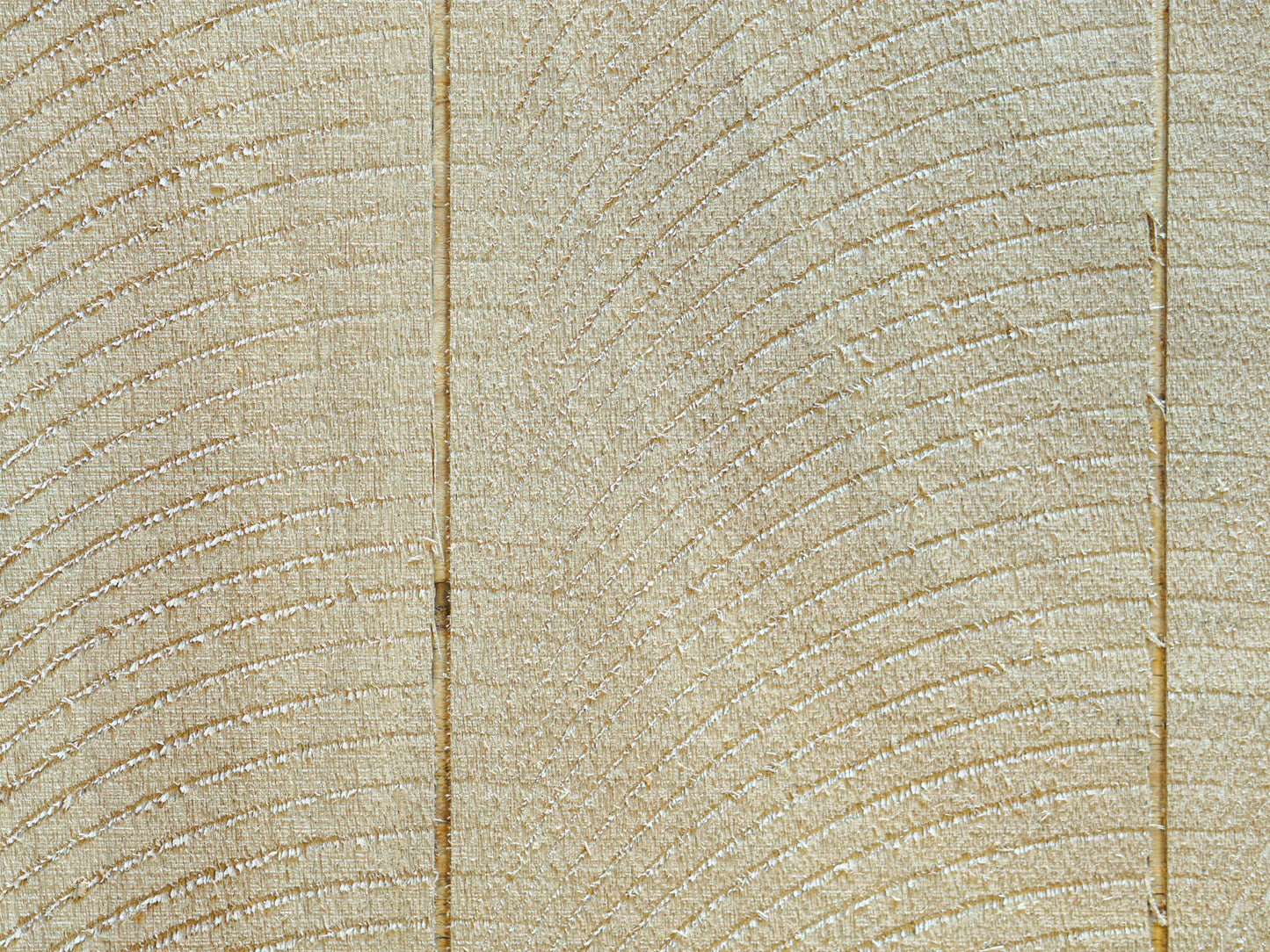 Close up of Planktex plywood pattern consisting of a rough saw, swirl appearance separated by 3/16” grooves, 8” on center, used on Eichler & Streng homes