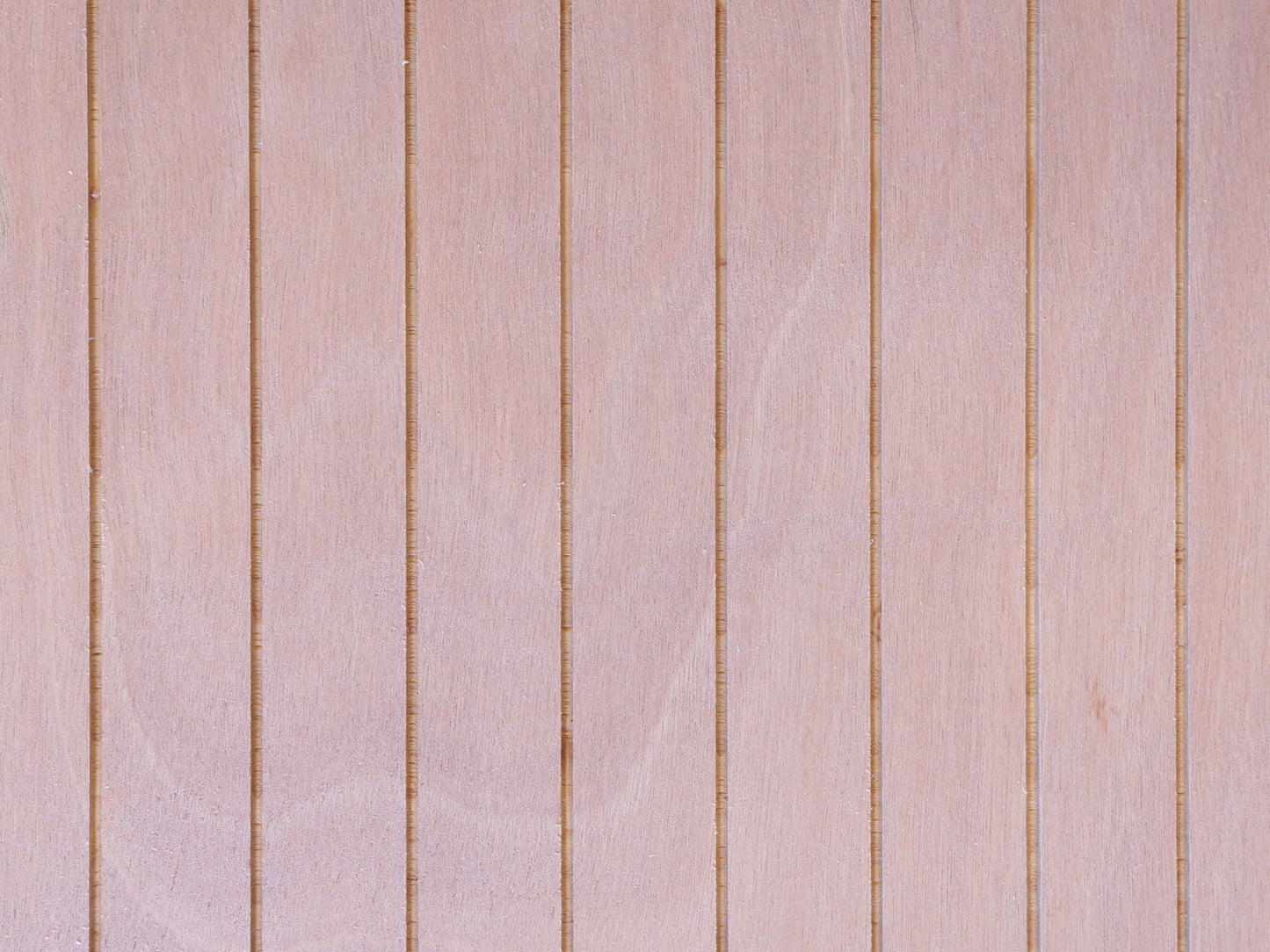 Close up of Thinline patterned plywood consisting of a 1/8” grooves, 1⅝” on center, commonly used as siding and paneling on Eichler homes and other mid-century modern design